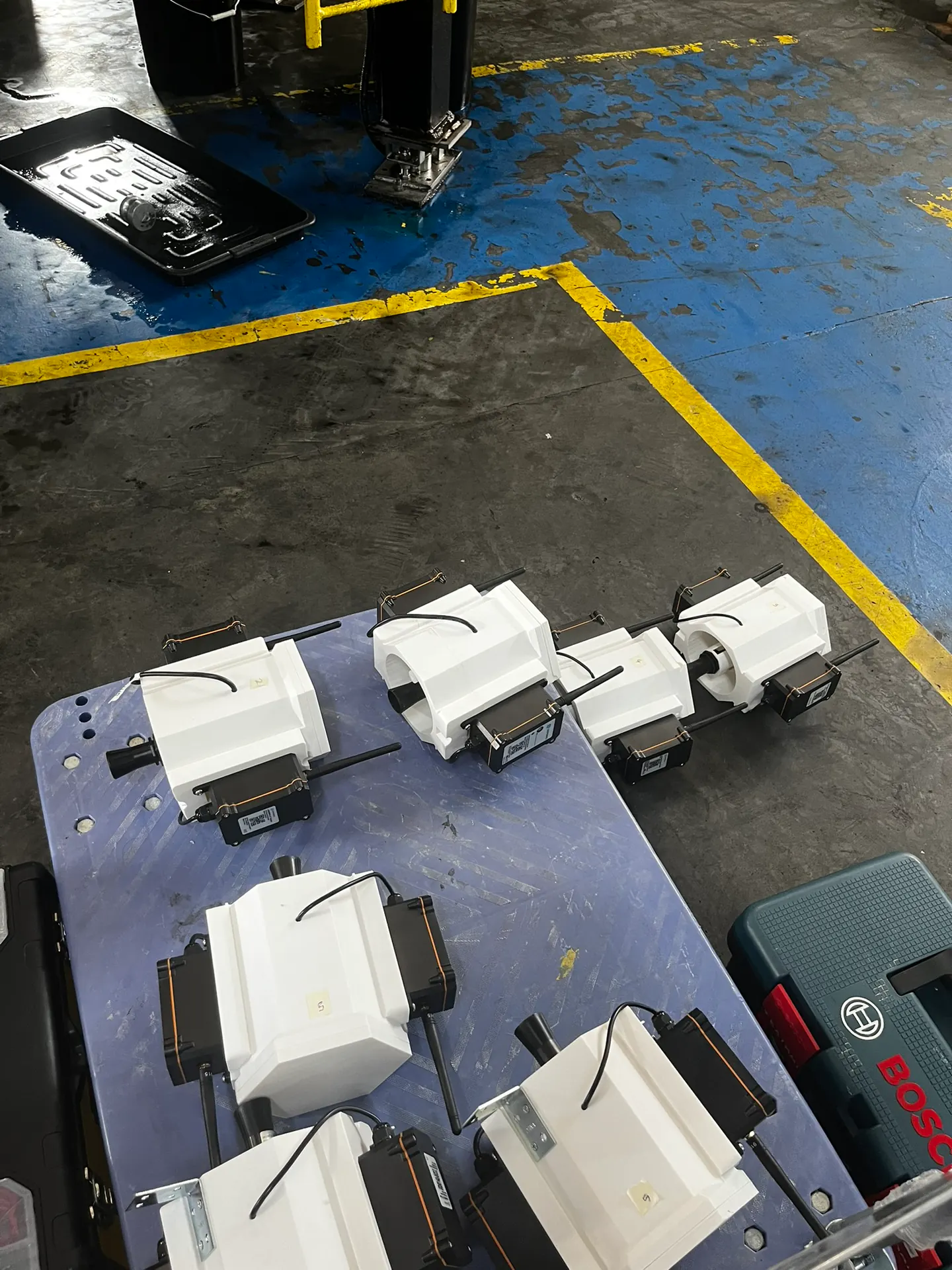 Dragino tank-monitoring units in custom enclosures prepared for installation