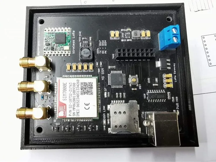 Custom RFM95W LoRa P2P gateway board with SIMCom SIM7000E module in an enclosure