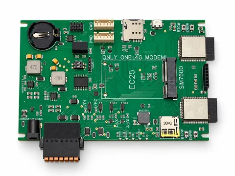 Green gateway PCB with two shielded wireless modules, empty modem socket, battery holder and field connector